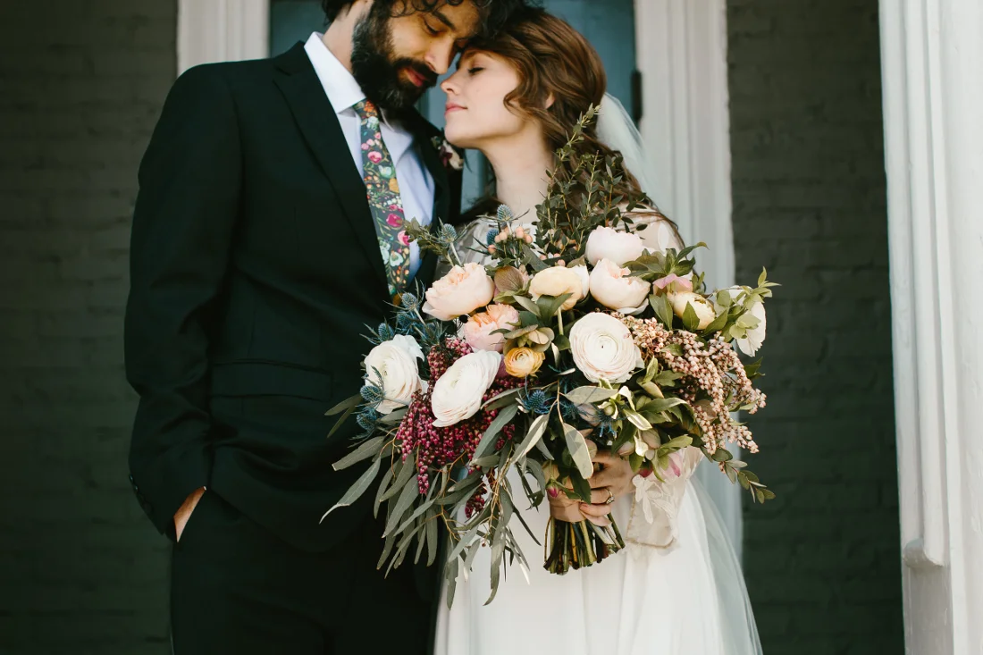 bride and groom stunning bouquet.jpeg
