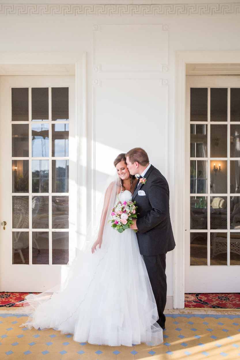 groom kissing bride.jpeg