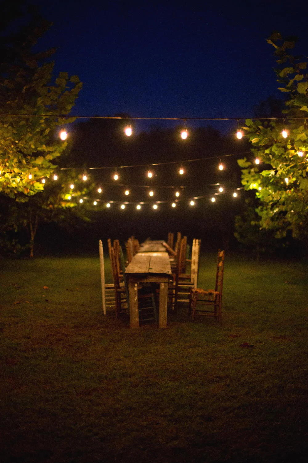 reception tables under string lights.jpg