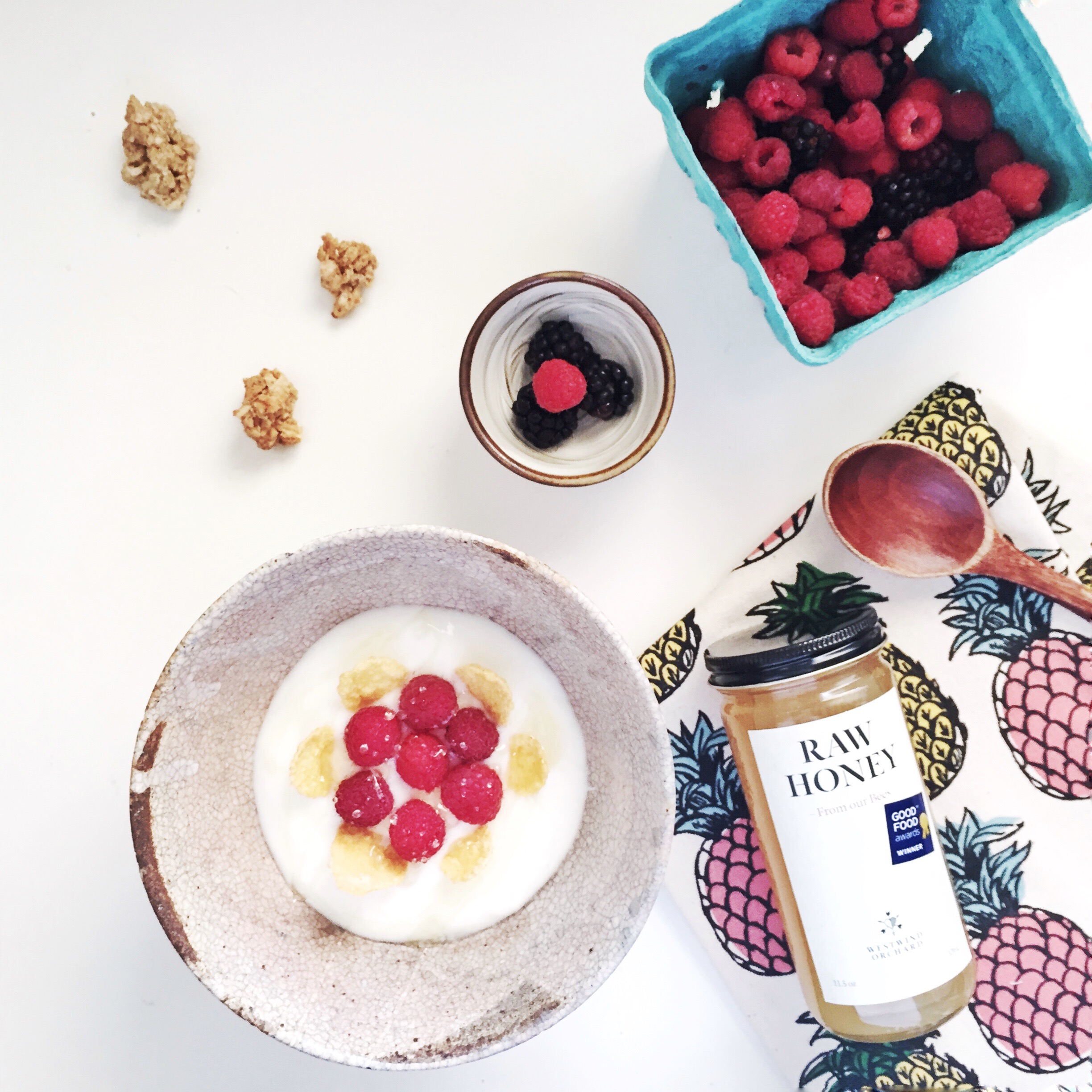 Breakfast yogurt bowl with self-picked raspberries, blackberries and the Raw honey from the Orchard