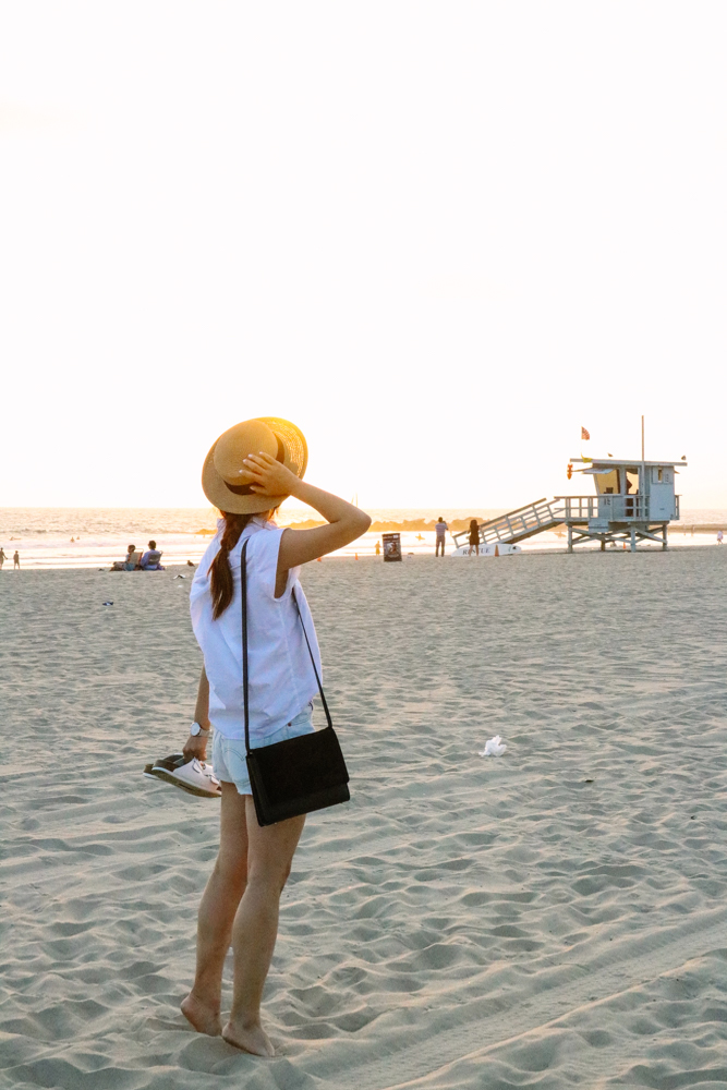 Urbanoutfitters Hat, Zara top, Levis Shorts, Cluse Watch, Everlane Petra Bag, Birkenstock Slippers