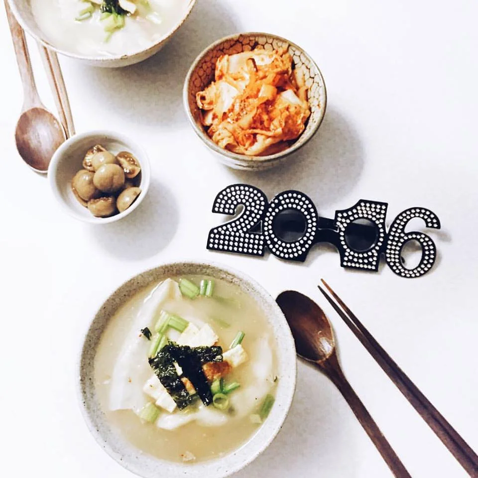 Self-made Korean traditional new year's day food, Duk Mandoo Guk 떡만두국 ( Korean Rice cake Soup with dumplings )