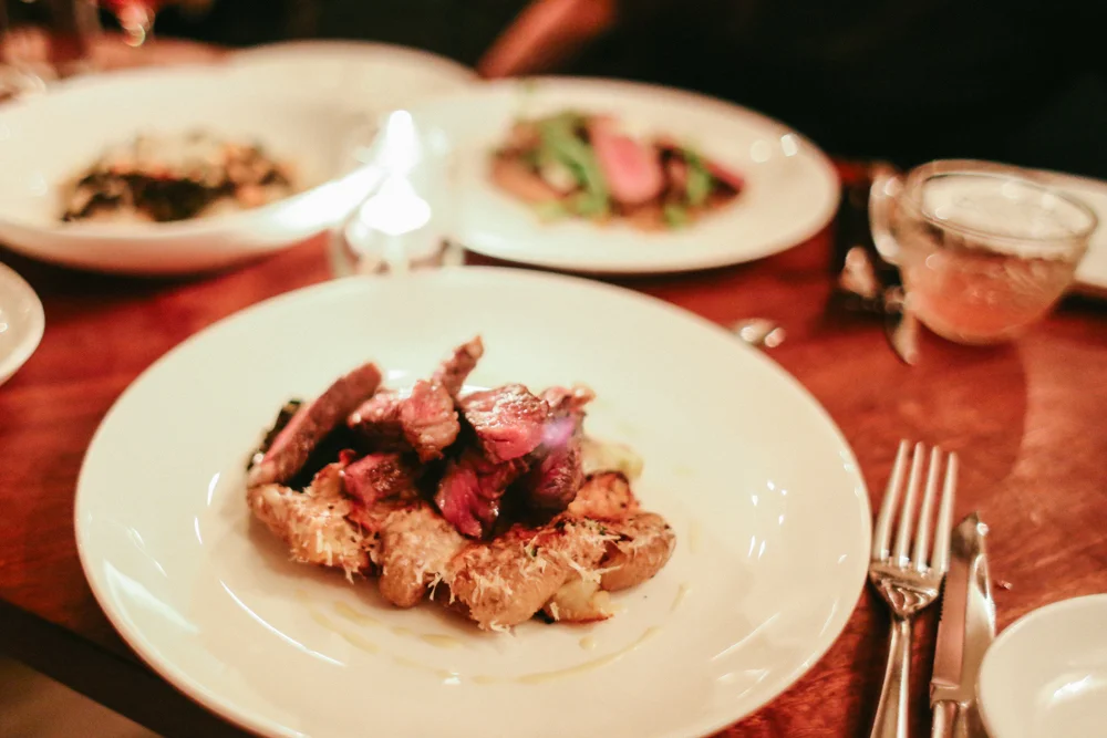 Grass Fed Ribeye, Crisp Potatoes, Charred Lettuces, Vinaigrette