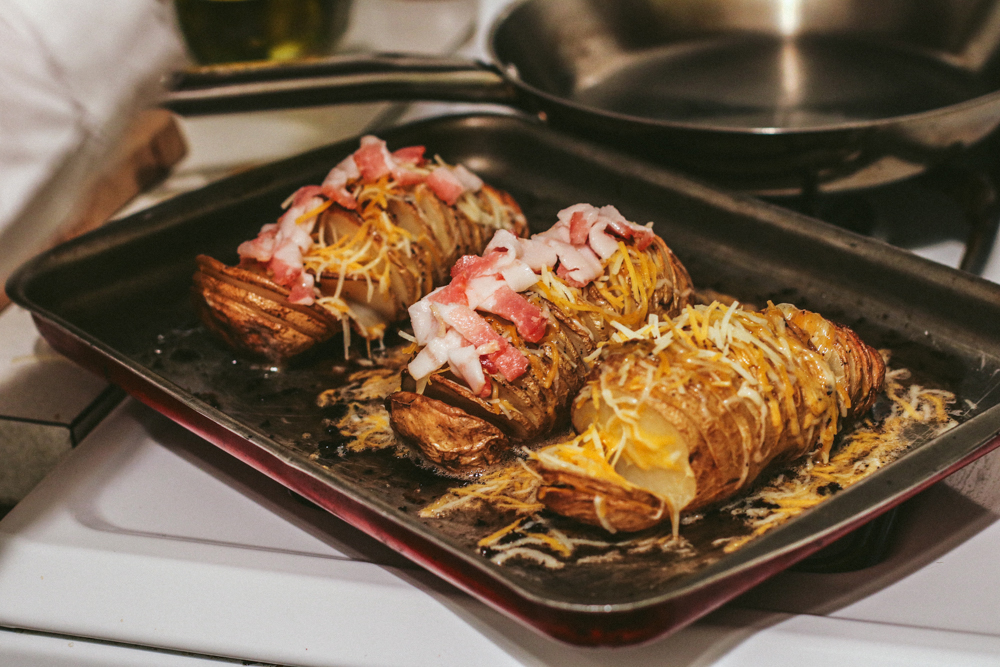 Place bacon in-between/on-top of the potatoes