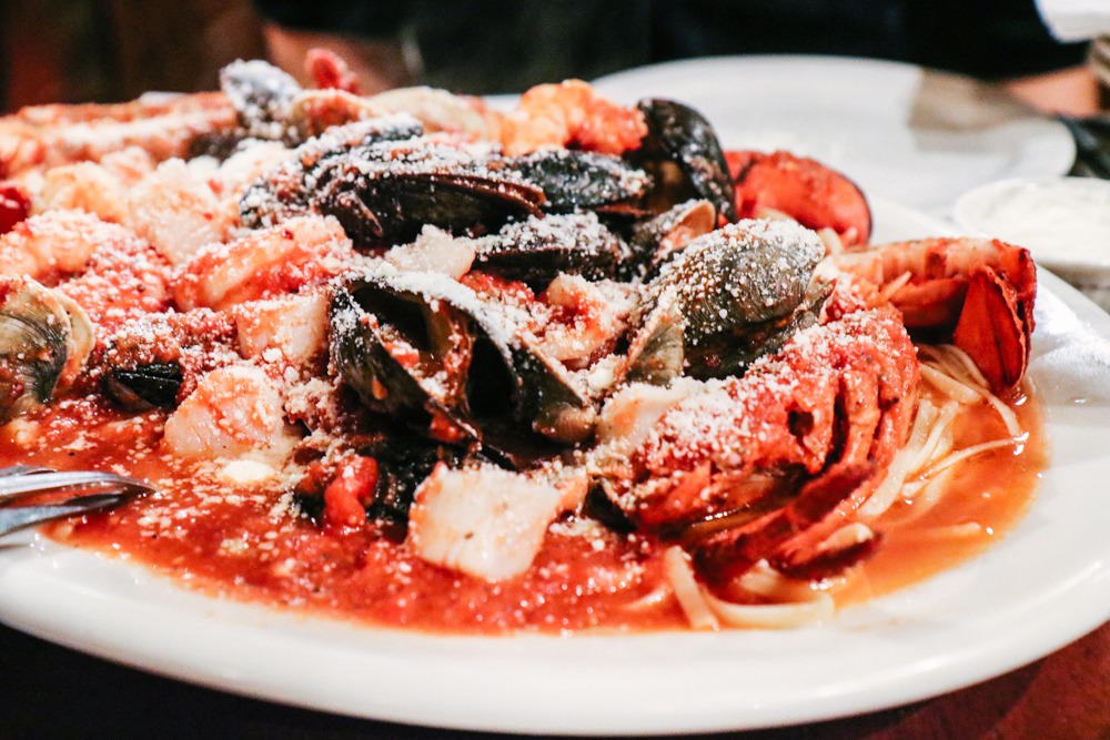 Zuppa Di Pesce, (for two) - shrimp, scallops, calamari, clams, mussels and lobster, served over lingiune with your choice of sauce pesto, fra diavolo, red, giacomo or scampi