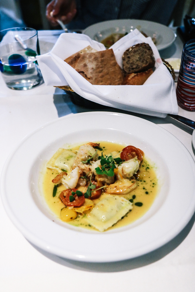 Ravioletti with Shrimp, grape tomatoes, white wine, garlic, basil, parmesan