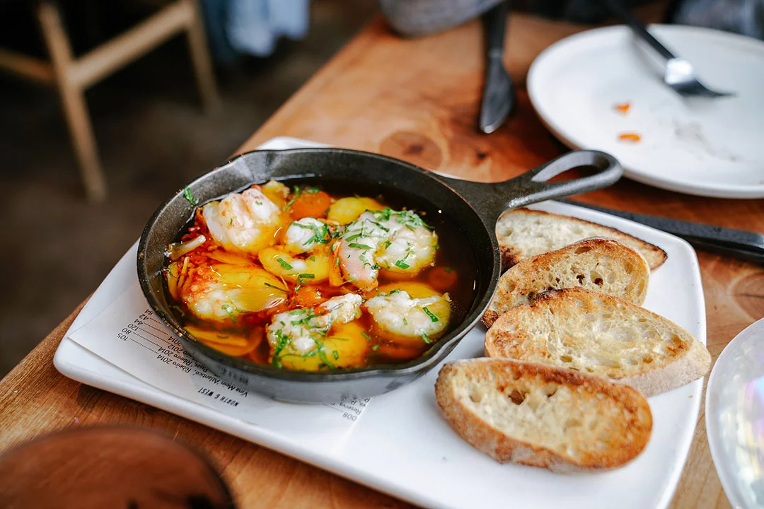 Gambas | olive oil-poached, gulf prawn, kumquat, garlic, chili, grilled bread