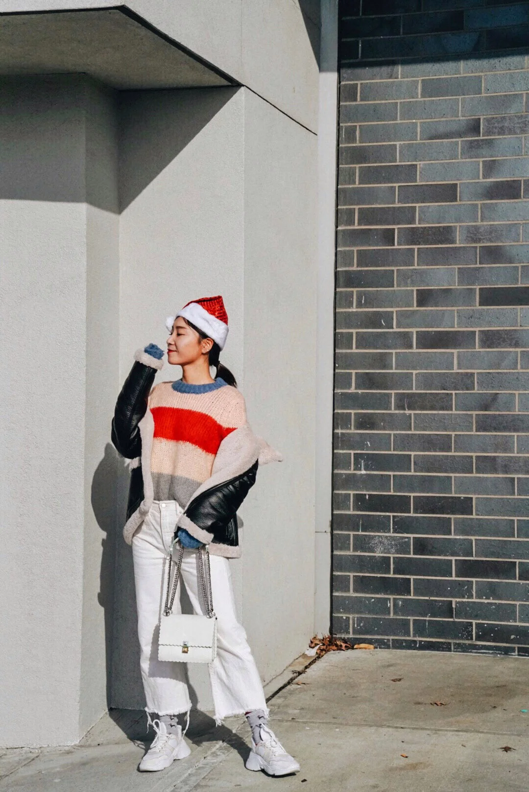 Wearing: Vince Camuto Sherling Jacket , Aqua Sweater , American Eagle Jeans, Schutz Sneakers, Fendi Bag