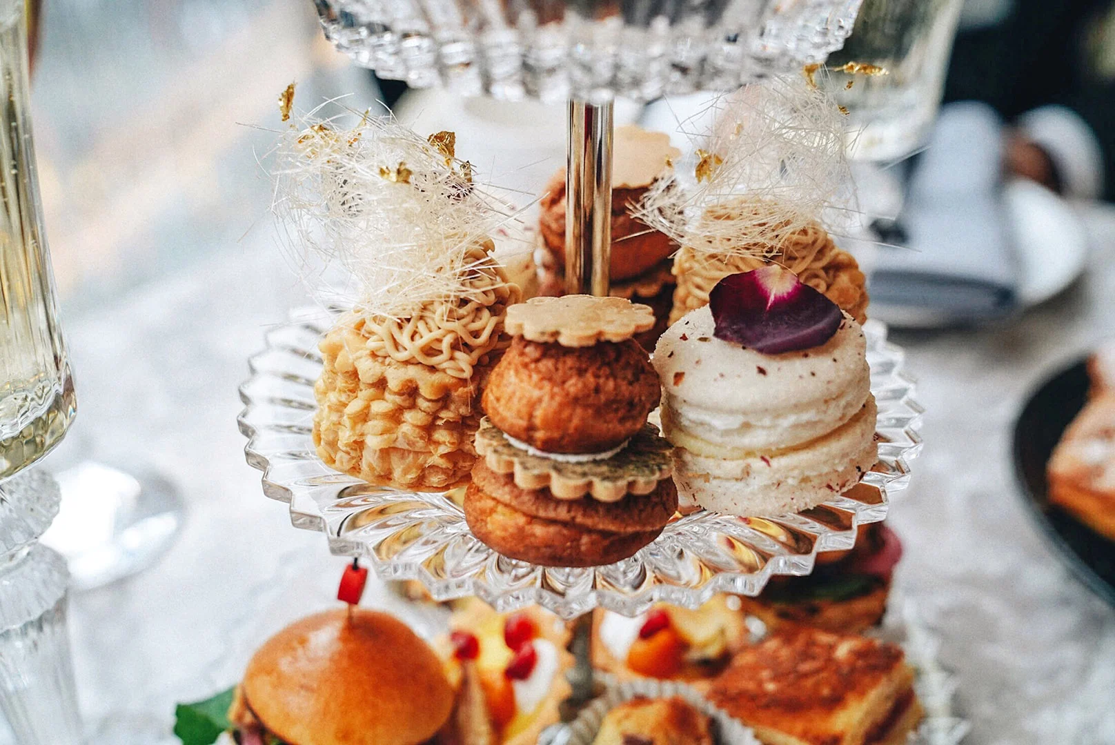 Moving on to SWEETS: Spiced Chocolate Cherry Buche de Noel, Early Grey Religieuse, Rose Macaron, Sugar Plum Cake Lemon Honey Vol au Vent