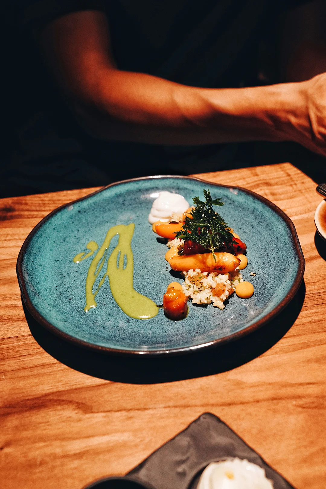 Glazed baby carrots, goat cheese, dried fruit bulghur, cumin oil