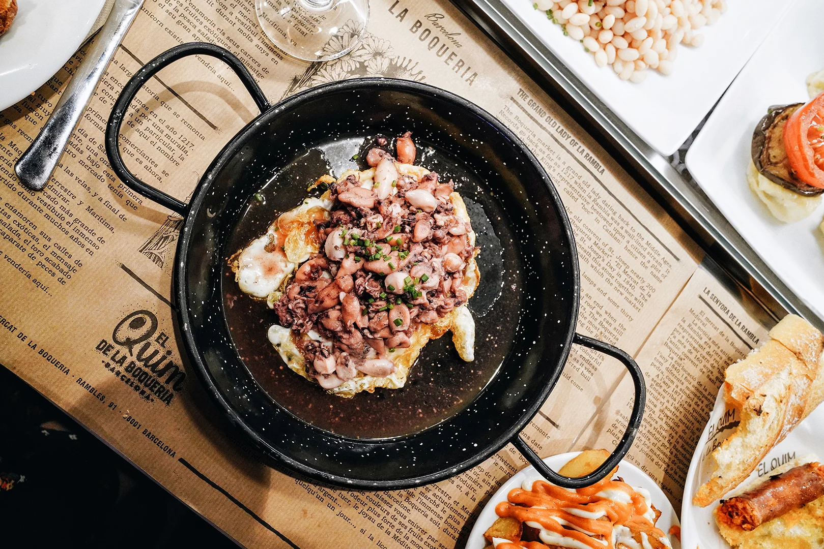 House Speciality: Fried Eggs with Baby Squids. Eggs and baby squid fried with olive oil, garlic, chilly pepper, maldon salt and black pepper.