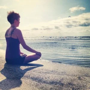 wouldn't it be great if self care looked like this all the time? meditating on the beach!
