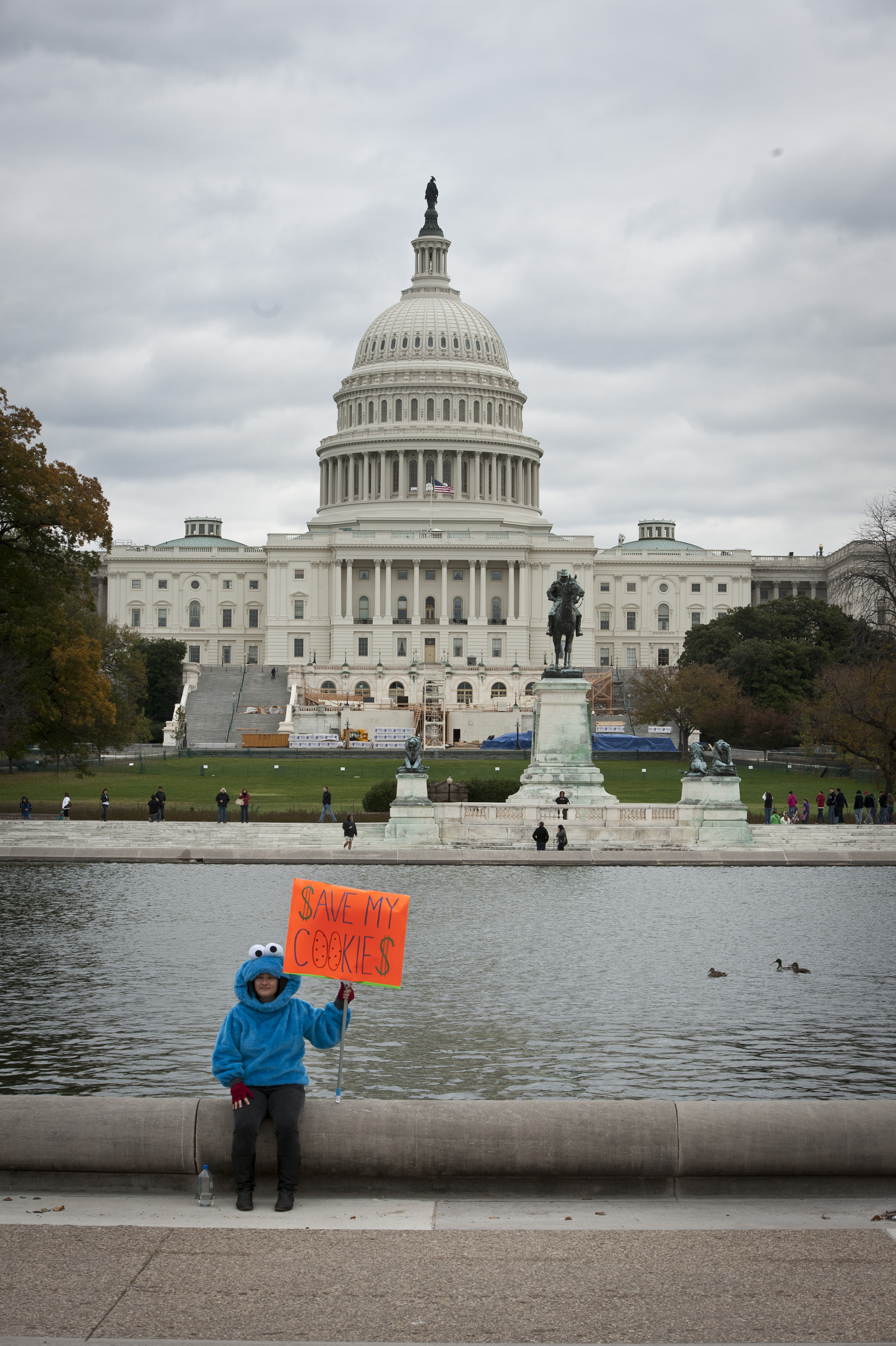  A protester sits in front of the Capitol at The Million Puppet March to Save PBS in Washington D.C. on November 3, 2012. 