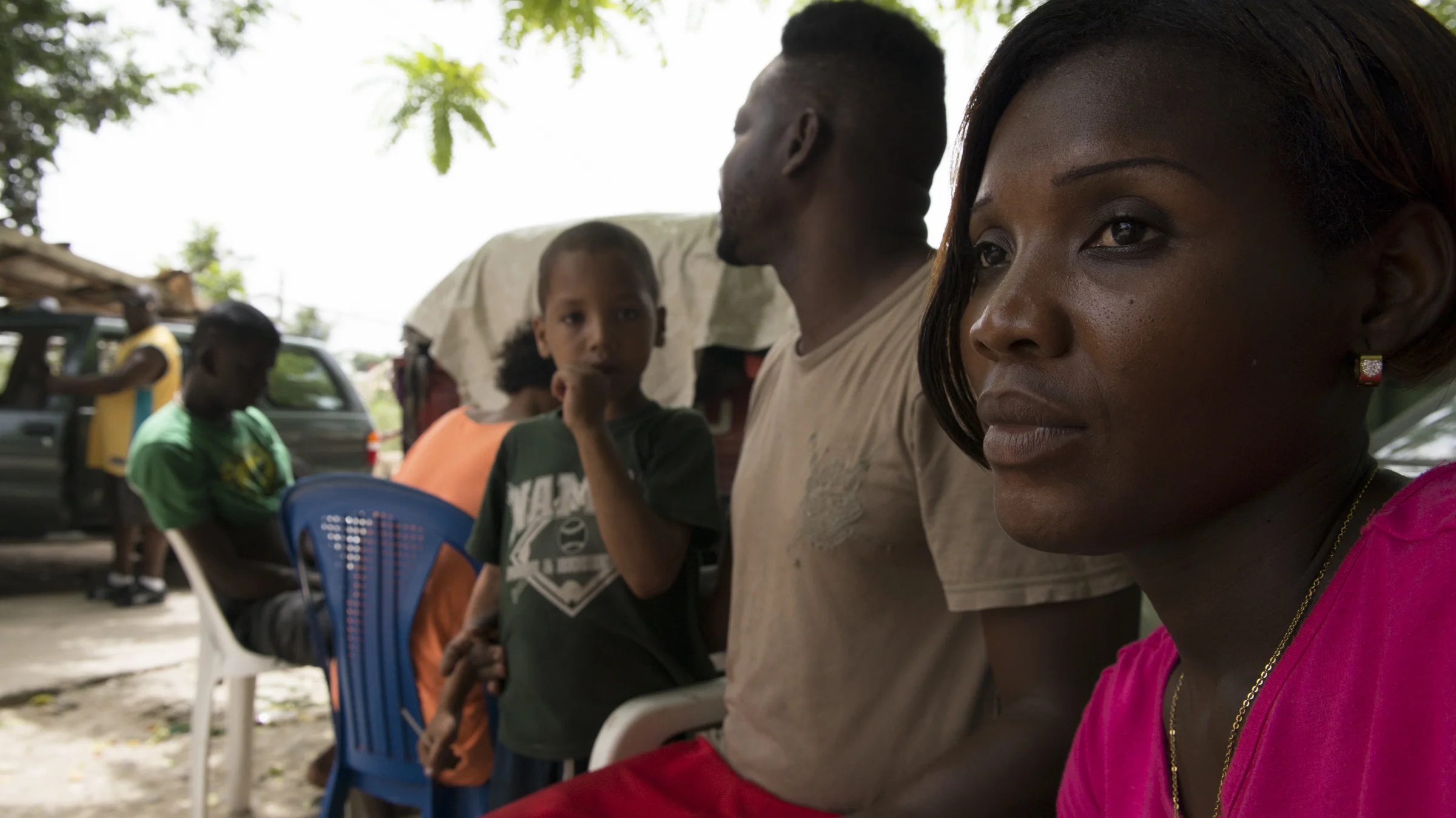 Carina Casimiro sits with a group of friends in her neighborhood, Bateye Bienvenido, outside of Santo Domingo, Dominican Republic on June 19, 2015. Casimiro grew up in the Dominican Republic and has built a life there with her children. However, because of the fact that she was born in Haiti, she is part of a group of people, Dominicans of Haitian decent, who have been stripped of their citizenship and are being forced to reapply or face deportation to a country most barely even remember.