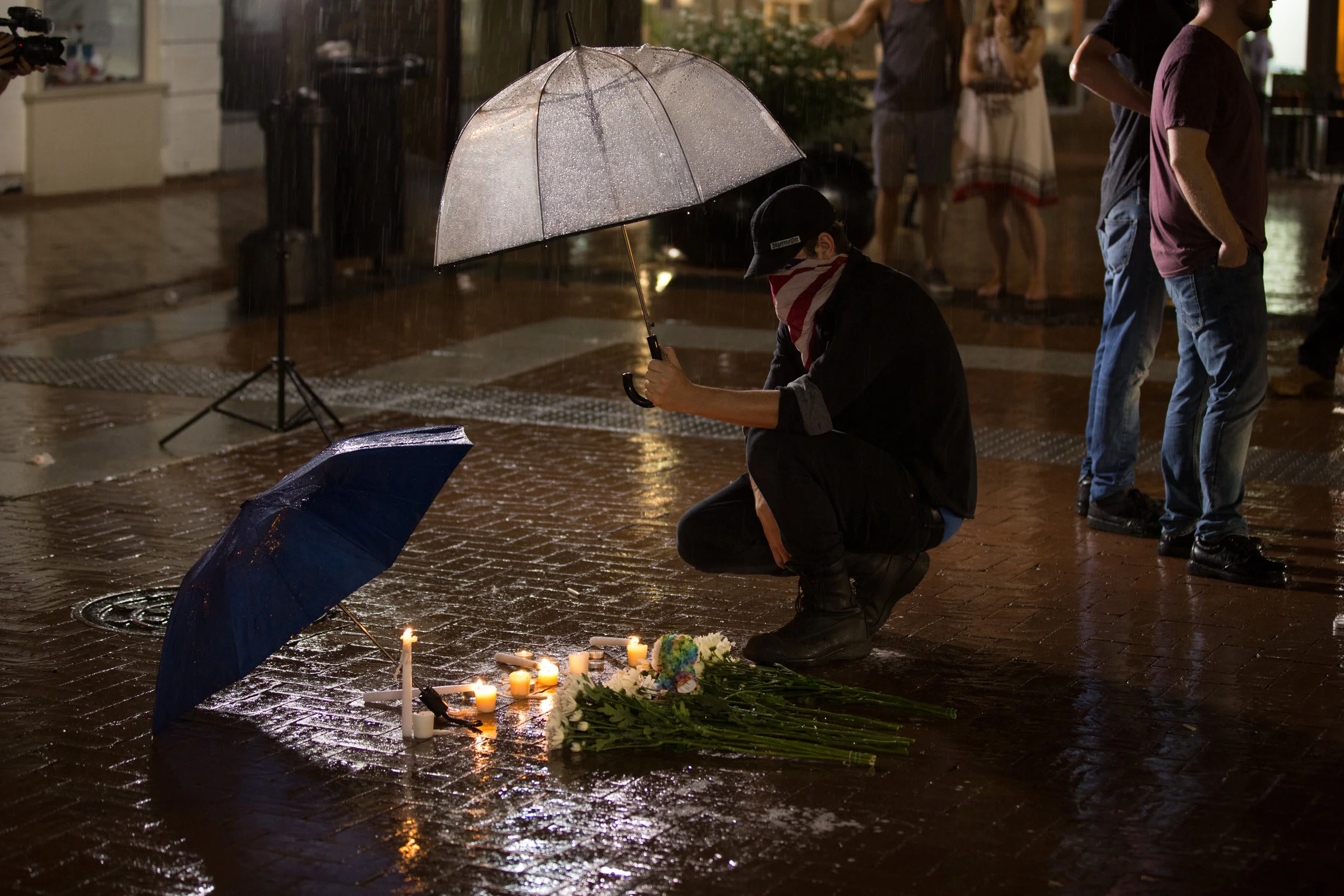 Vigil in Charlottesville, Va, after the attack the left Heather Heyer dead and 19 others injured.