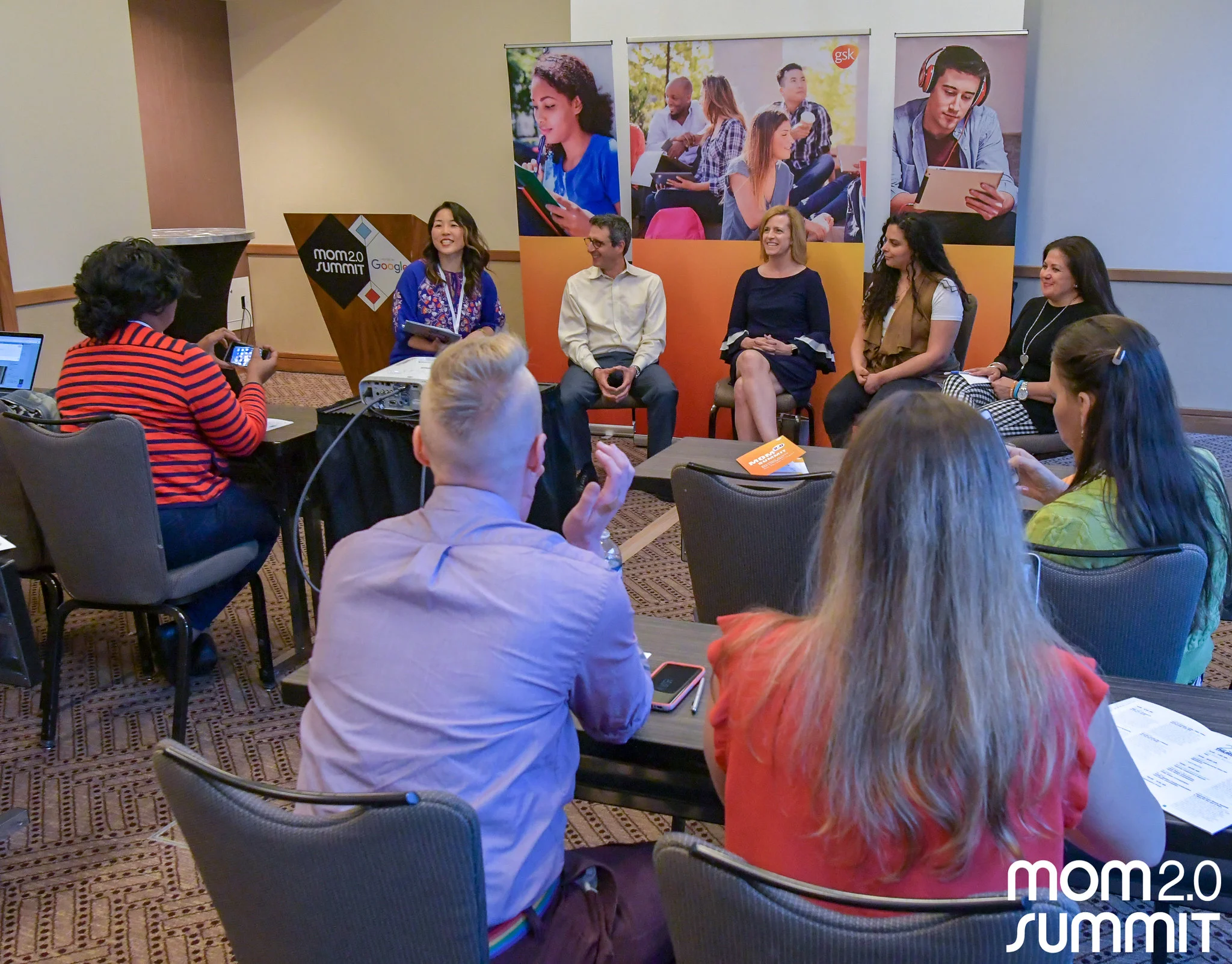 Christine moderating a panel on vaccines; photo by Mom 2.0 Summit