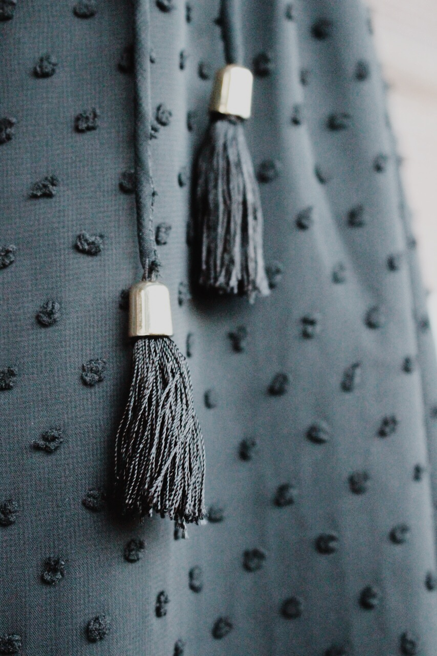 These tassels capped off in shiny, gold hardware were beautifully crafted and added to the bohemian feel of the dress.