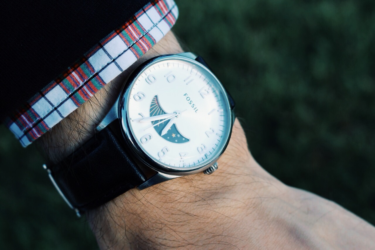 A good watch is a key accessory in a man's wardrobe, and this Fossil watch features a cool umbrella-shaped cutout with an illustrated moon and sun plate that rotates as time passes.