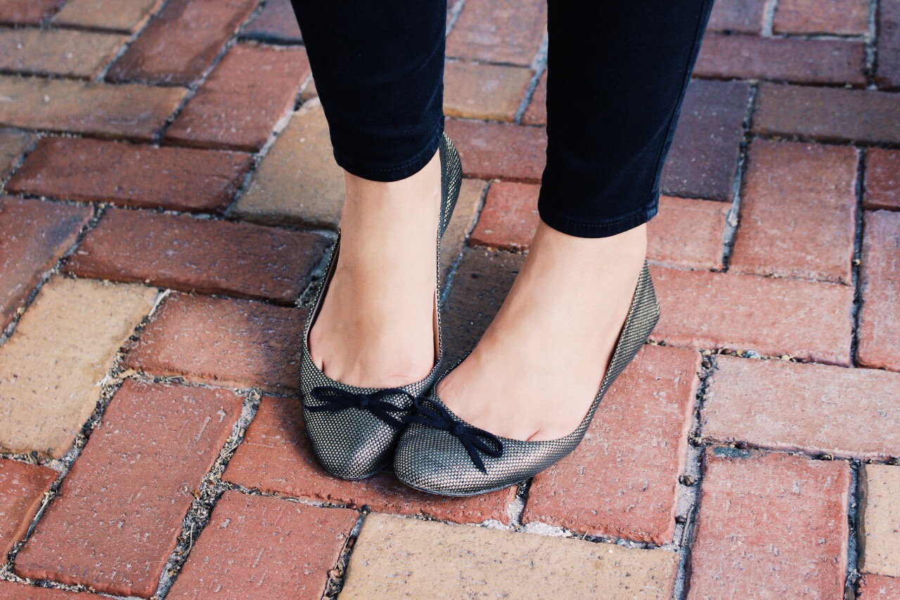 These metallic gold Zara ballet flats with black bow detailing are a favorite of mine to add a little glitz to my everyday look.