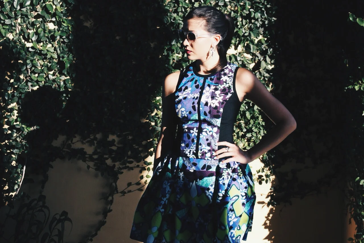 The bold black lines and side panels of this dress contrast nicely with the bright and colorful iris print.