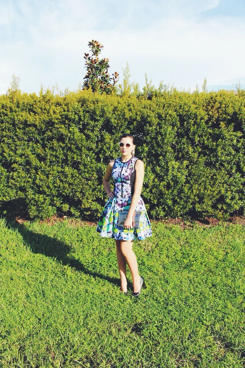 The colorful print of this dress is a showstopper, so no accessories should take the spotlight away from it. I kept my shades, shoes and clutch all neutral to complement the dress and not overpower it.