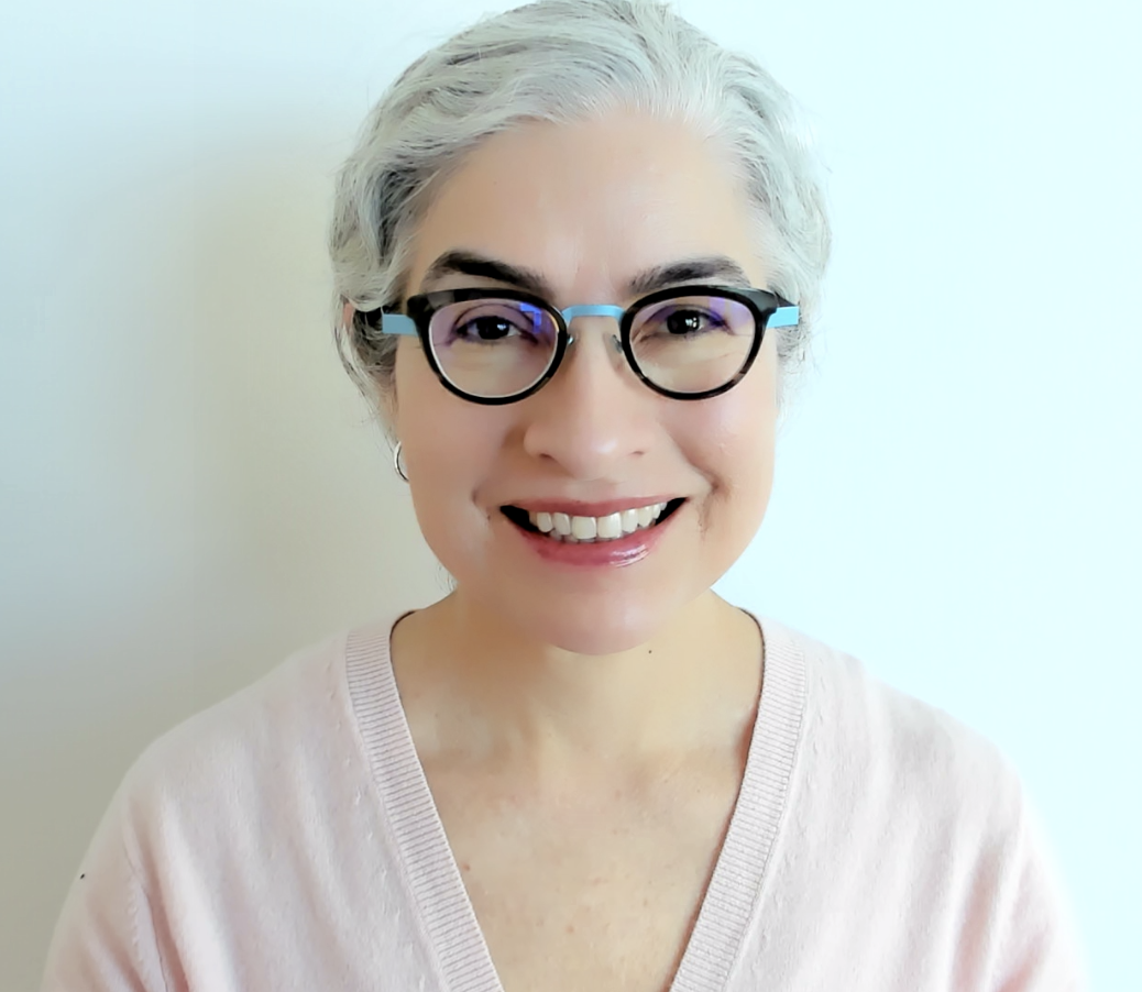Headshot of Jessica Santascoy, smiling warmly at the camera. She is wearing professional attire and has a friendly, approachable expression.
