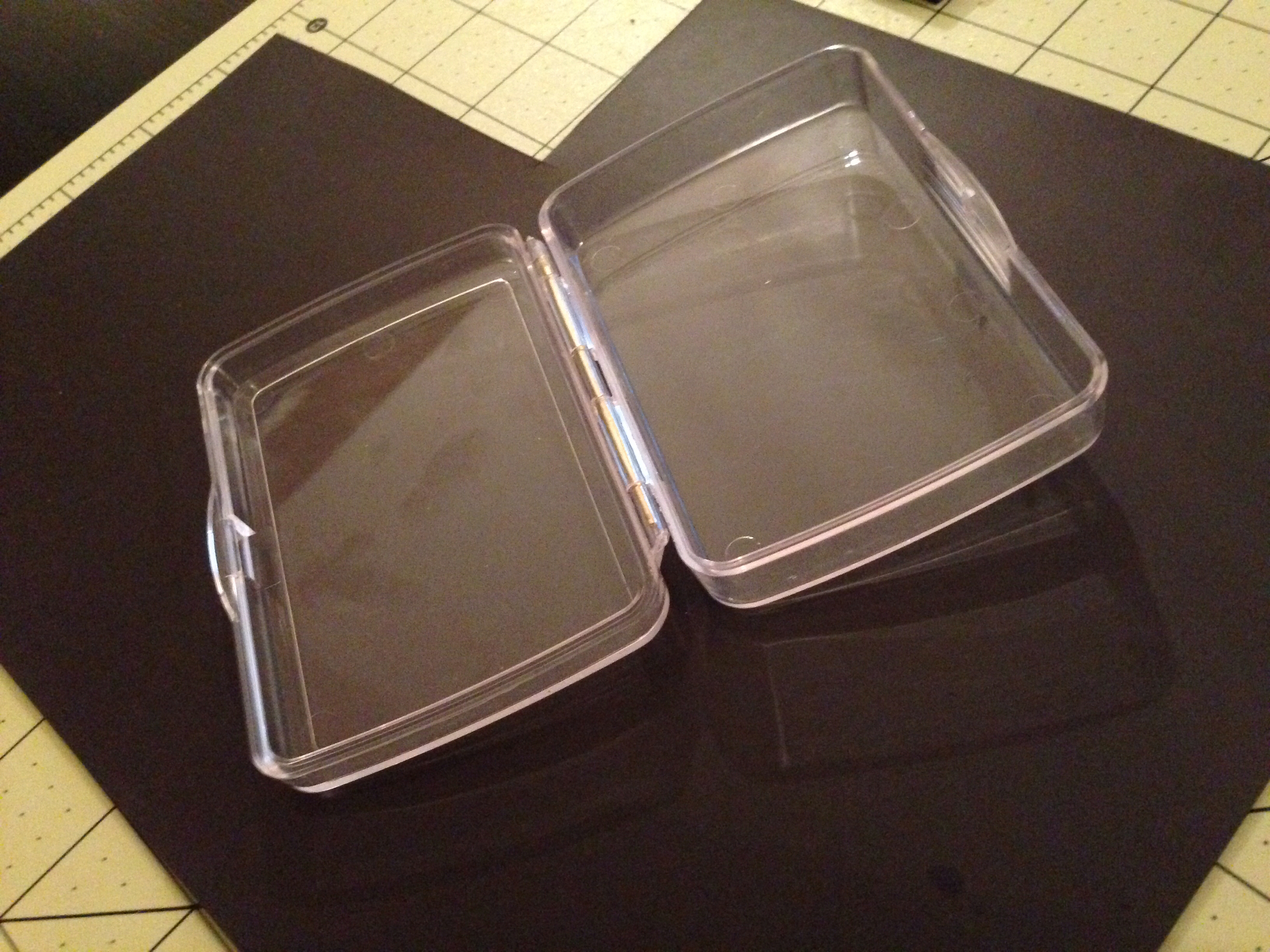 Use the case to get a rough outline the size of the box on the magnet. It should be a little more than 2.5" wide and about 3.5" tall. 