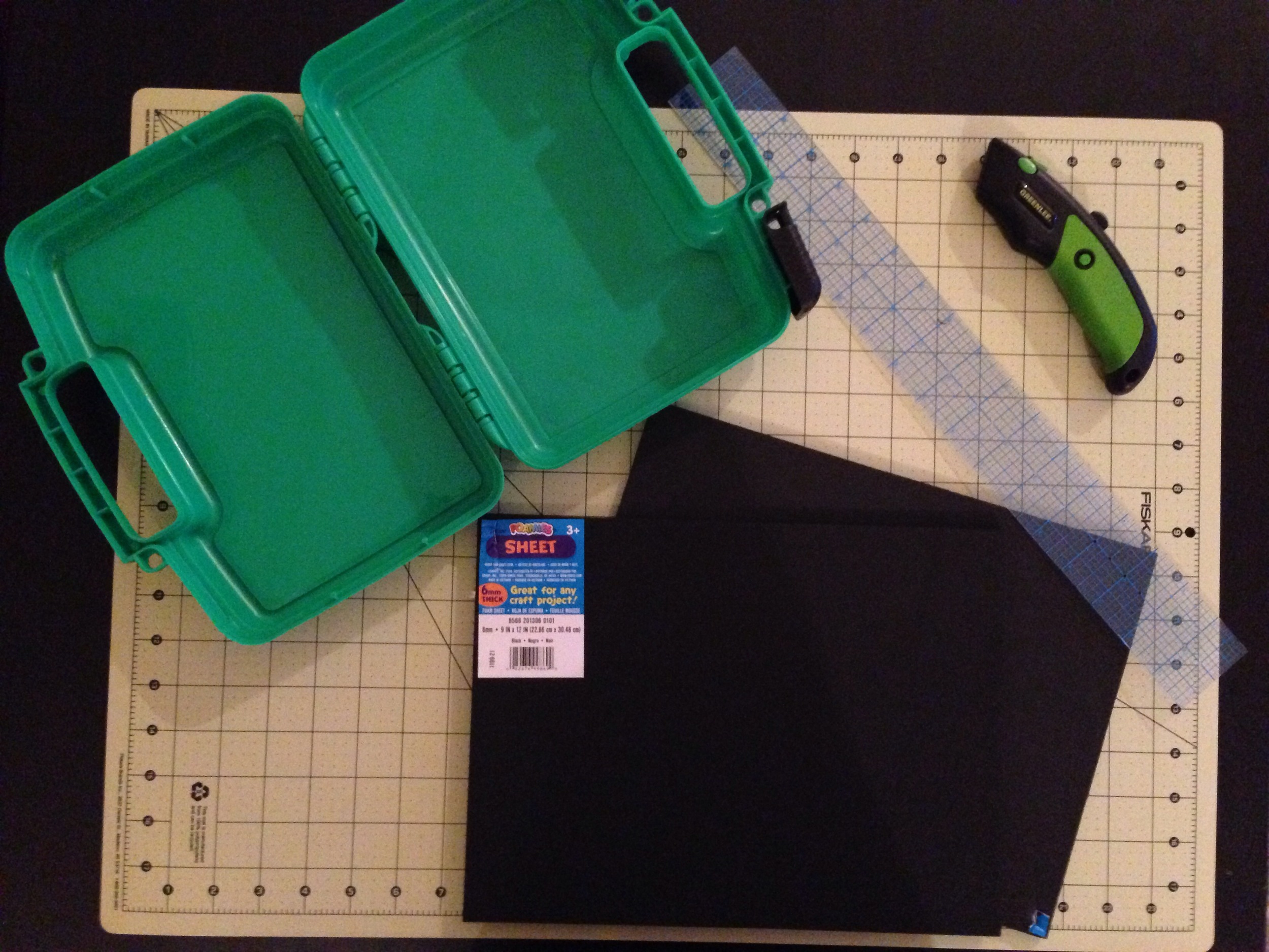 For this you'll need two (or four if you want thicker pad) sheets of 6mm foam, Flambeau case (this is the 10 1/2 in), a razor cutter or Exacto knife, a straight edge, and spray adhesive. 