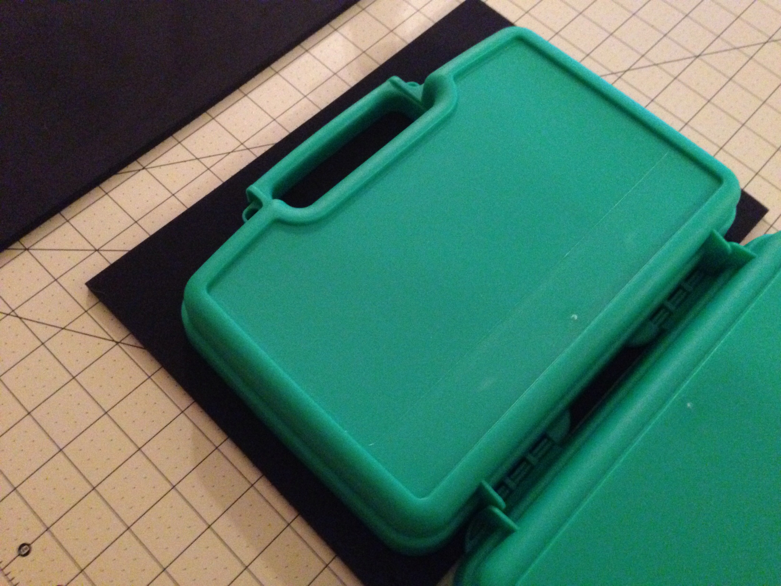 Using a hard surface, use the case's edge to create an indentation in the foam. 
