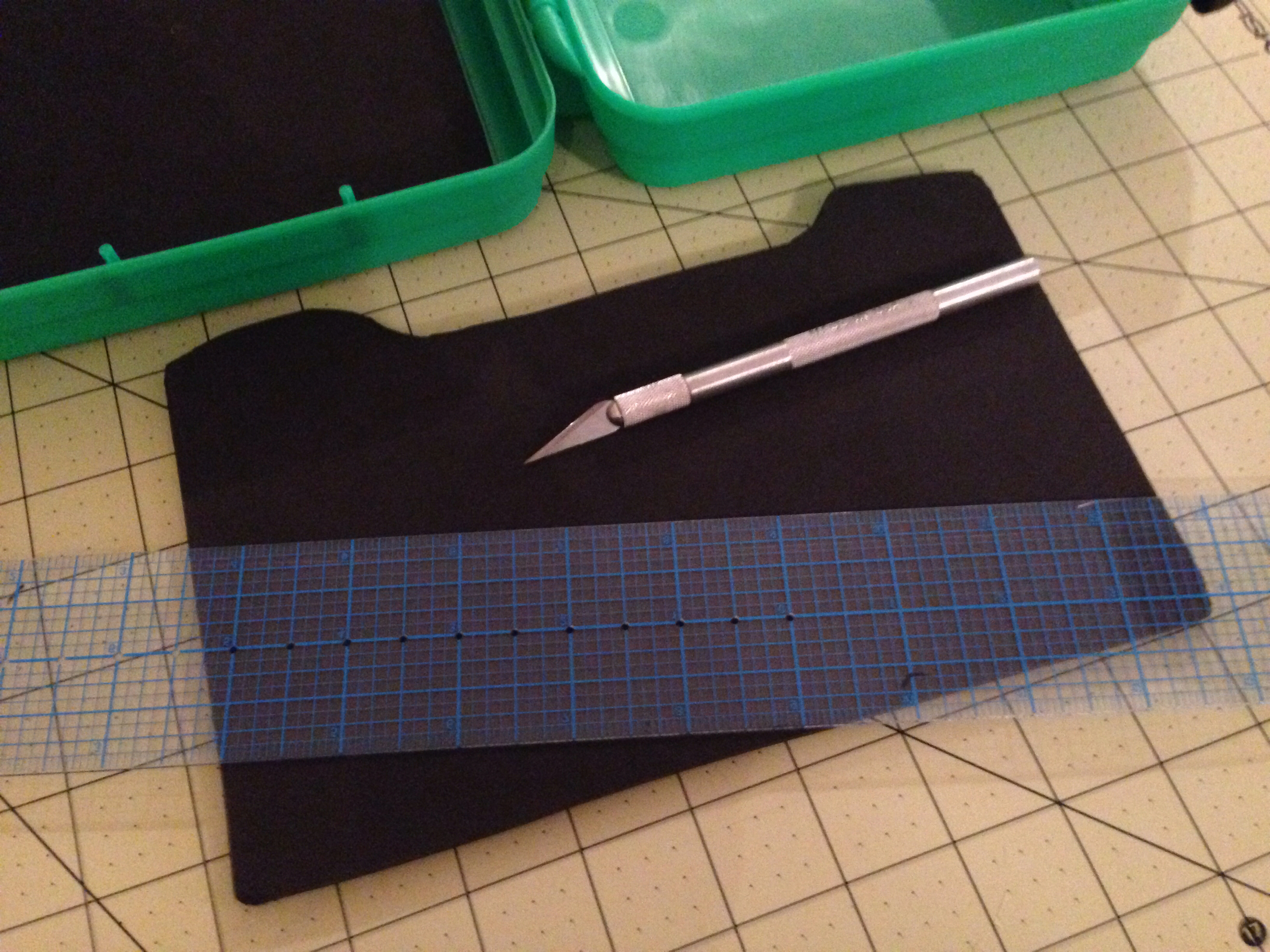 Grab that Exacto knife and using the straight edge, cut your slit about 3/4 of the way through the foam. Be careful not to cut all the way through. Any cuts through will allow your adhesive to leak through in later steps. 