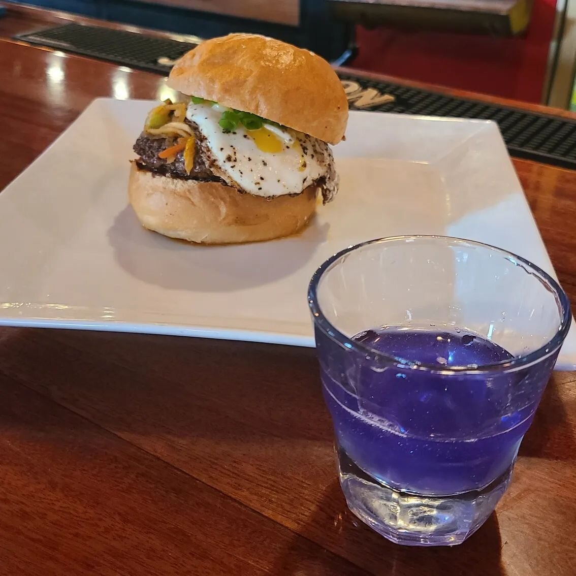 KPOP night is upon us! Our Seoul Burger is dressed to impress( house made Bulgogi bbq, Kimchi,  and fried egg) pair it with #BTS shot Louisiana's own @wetlandssake infused with purple ✨edible glitter✨