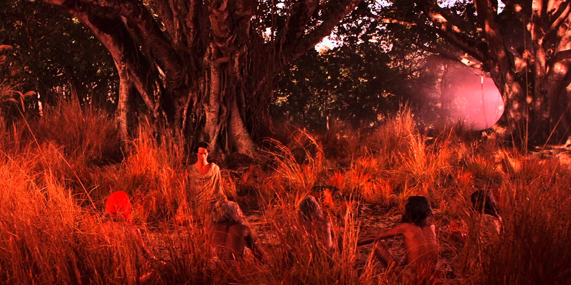 Siddartha (Keanu Reeves) meditates amongst his first disciples in Little Buddha