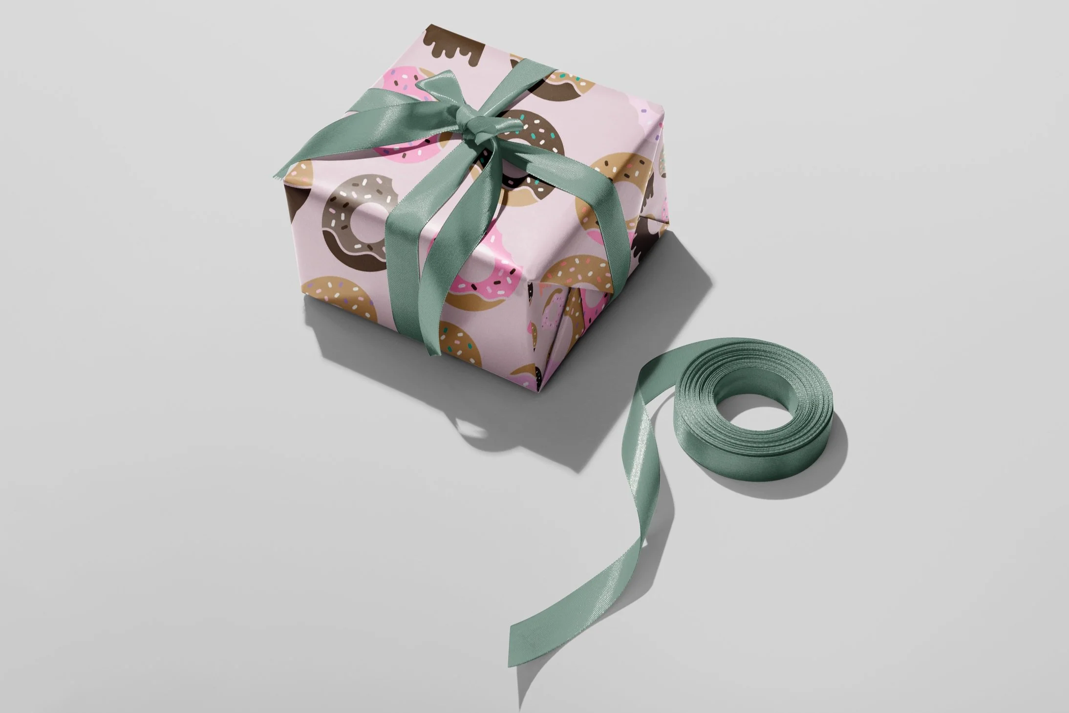 Gift+Box+Wrapping+Paper+Mockup+by+Creatsy+%282%29+grey+background.jpg