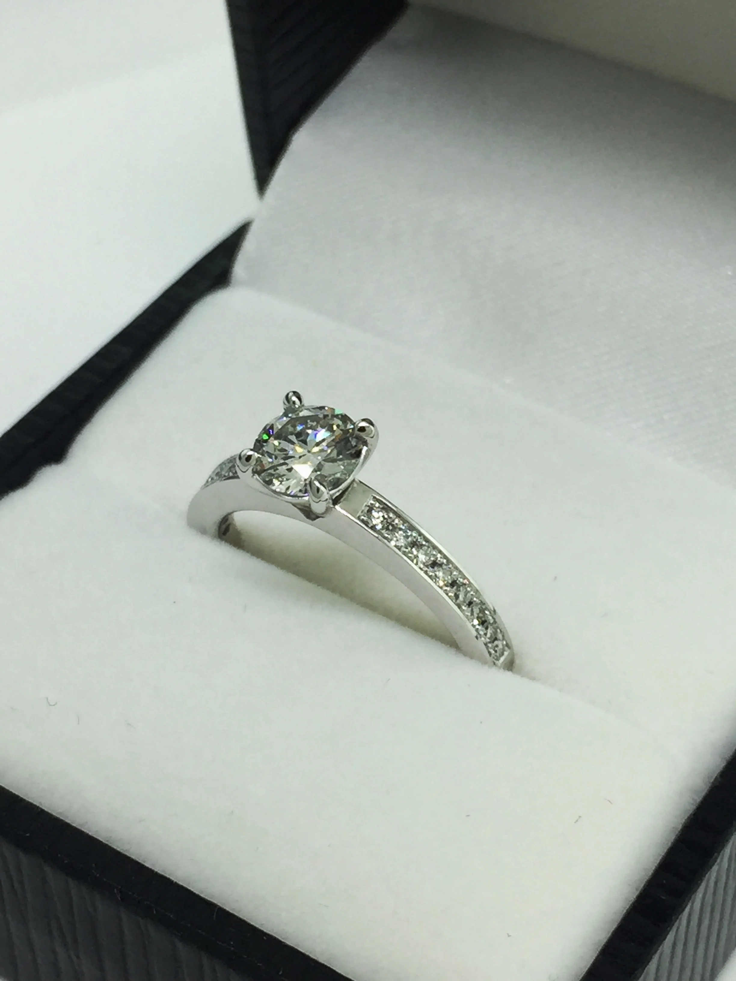 The finish piece, 18 carat white gold and platinum engagement ring with 1.00ct brilliant cut diamond.