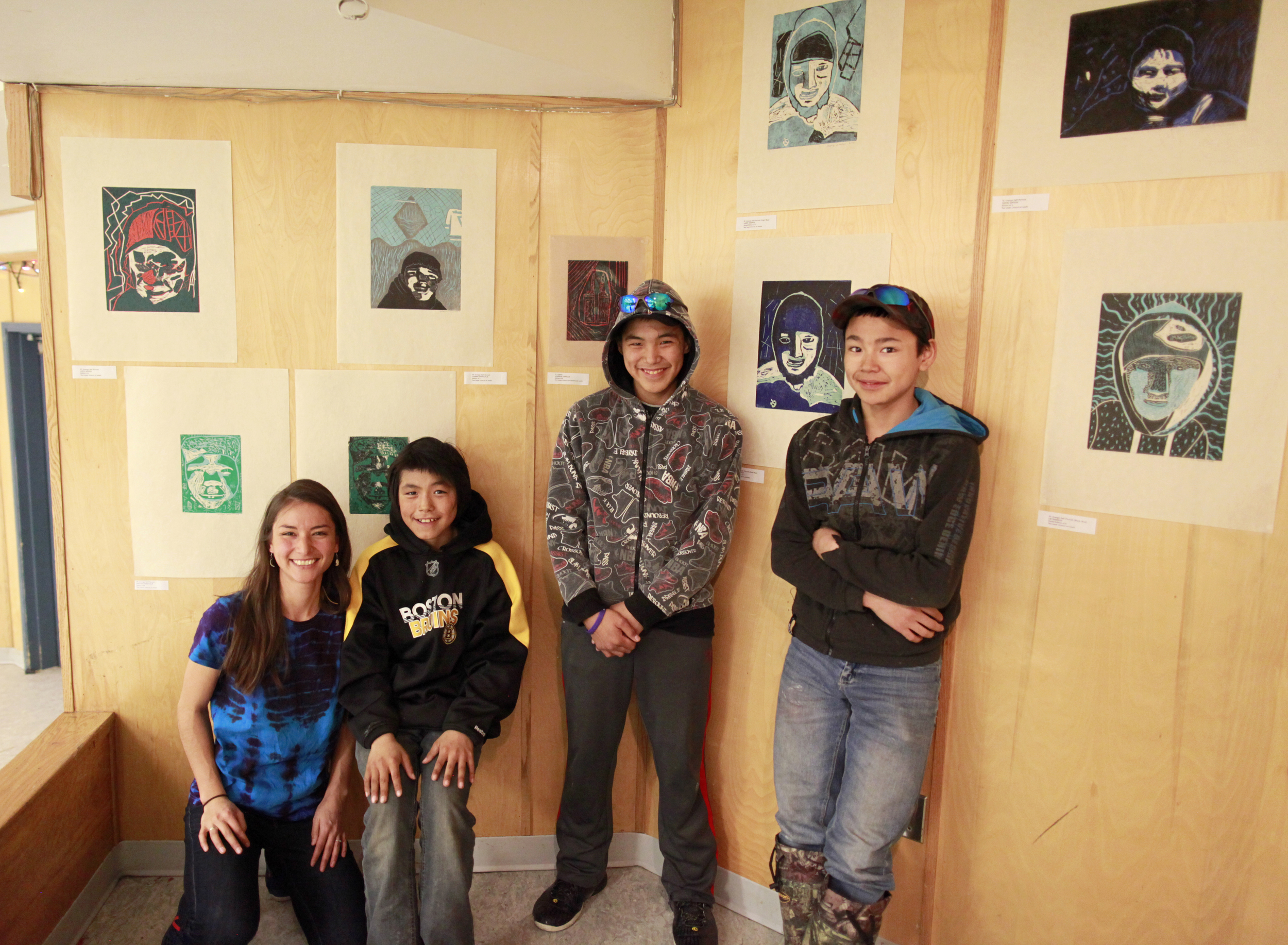 Alexa, Johnny, Harry, Latch. Harry is standing beside his two-layer linocut self-Portrait "Uvanga" that came 3rd across Canada for the Aboriginal Arts and Stories Contest!