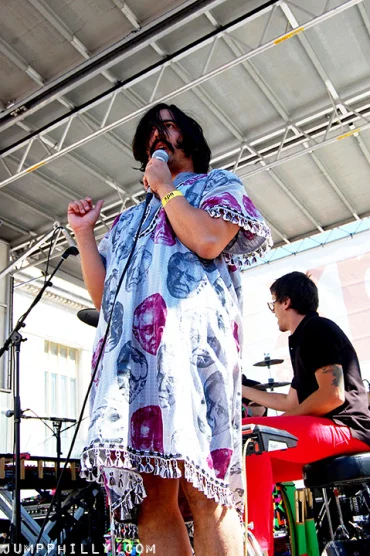 Photography by JUMPPhilly.com. Man man sporting Naomi's tunic live in concert. 