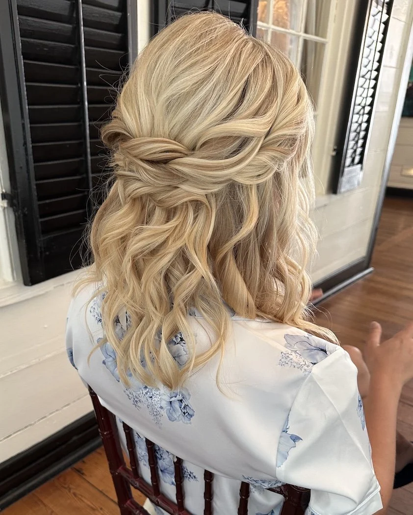 a blonde bride with fine hair is wearing a styled half up half down hairstyle