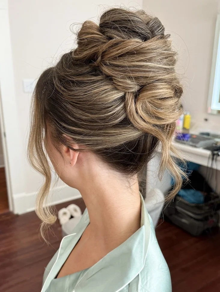 tousled high updo for a bride