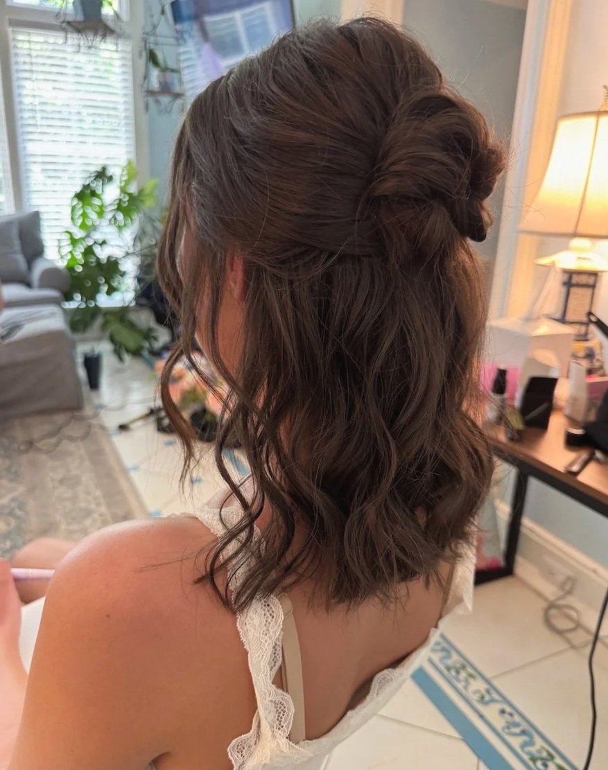 bride with short brown hair wearing a half up half down hairstyle