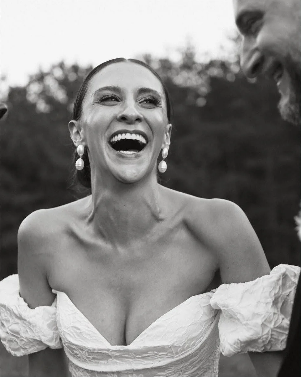 black and white photo of a classic bride wearing pearl earrings
