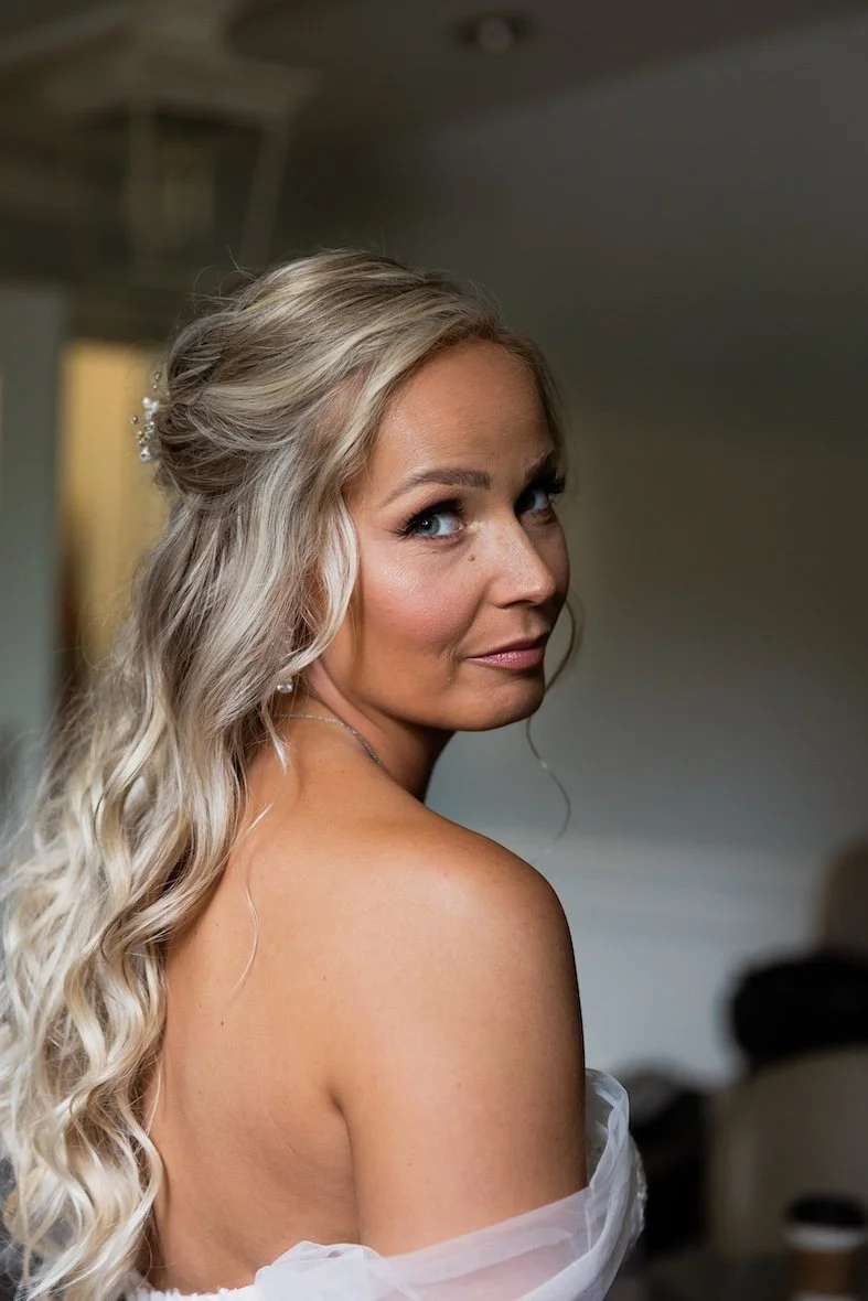 close up photography shot of a blonde bride wearing natural makeup on her wedding day