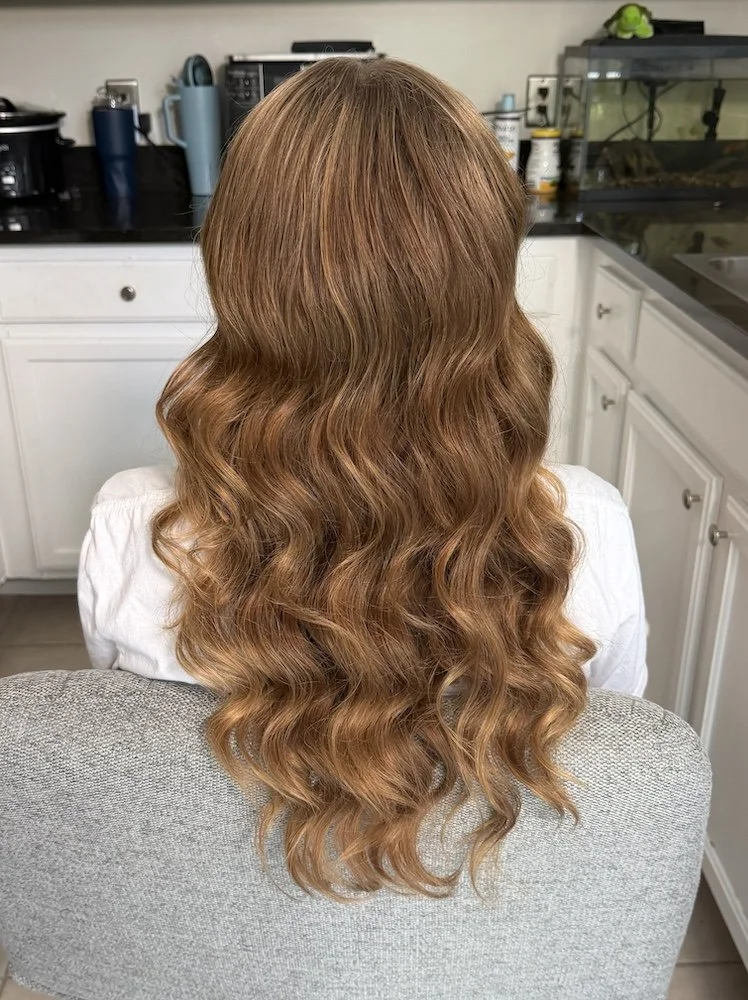 close up photo of a bride with red hair styled with glam waves