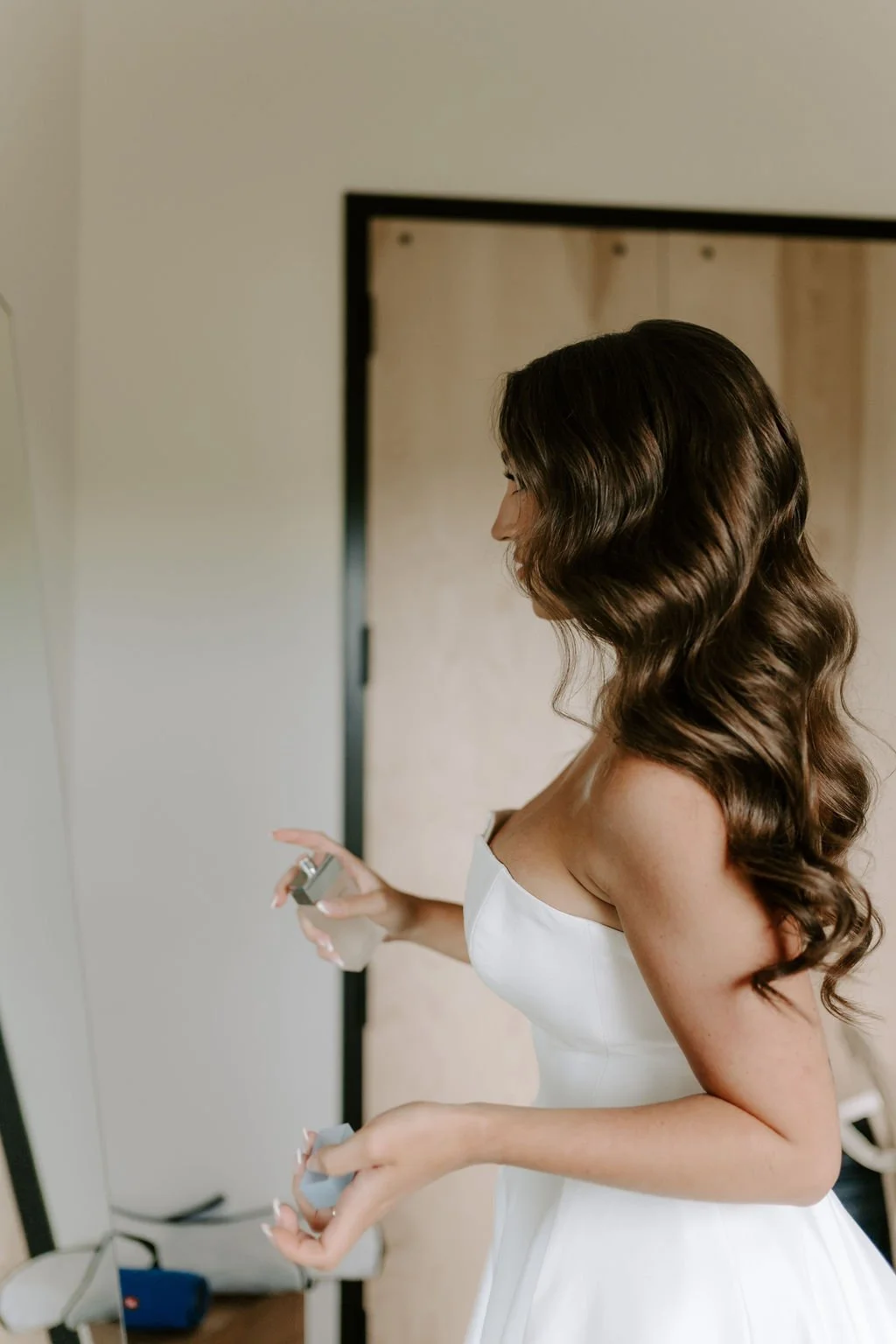 brunette bride wearing soft glam wave hairstyle
