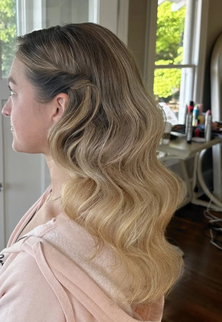 a bride with warm blonde hair and a glam wave hairstyle