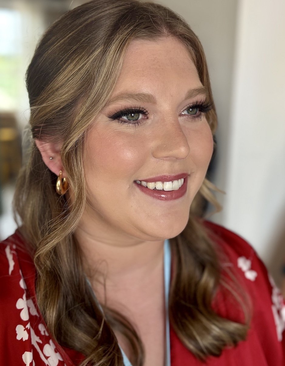 bridesmaid wearing makeup with a soft glam finish