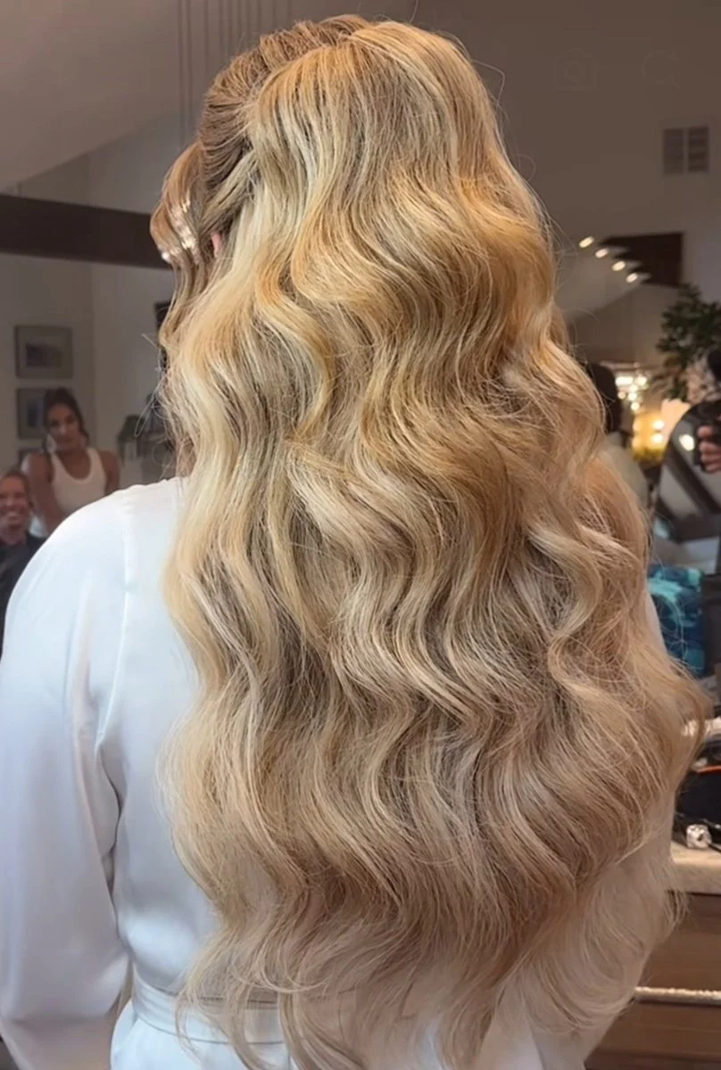 bride with blonde hair is wearing long clip in extensions
