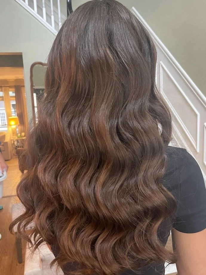 long brown hairstyle with down waves