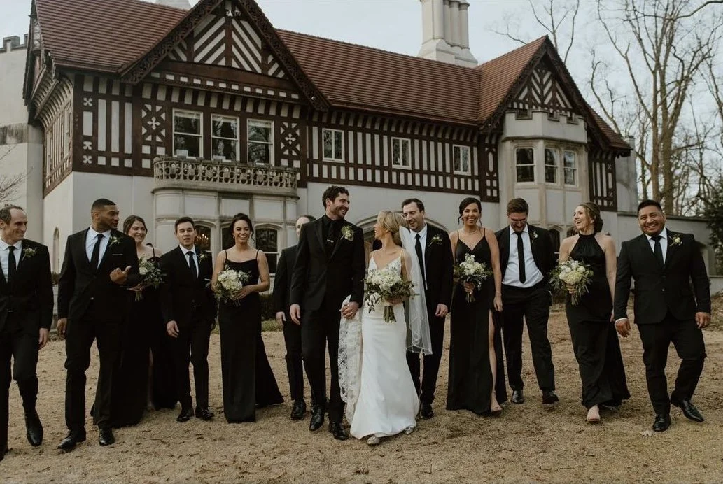 bride and groom wedding party walking in front of the historia callanwolde fine arts center