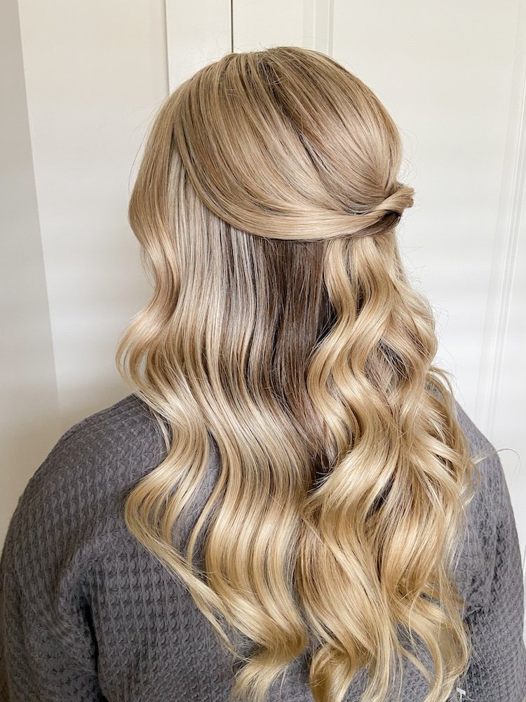 sleek half up half down hairstyle for a bride with blonde hair
