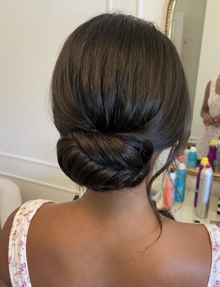 sleek bun hairstyle for a wedding ceremony